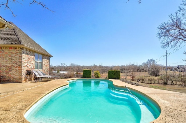 view of pool featuring a fenced in pool and a patio