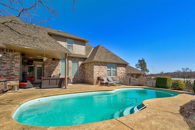 view of pool featuring a fenced in pool, a patio, ceiling fan, and fence