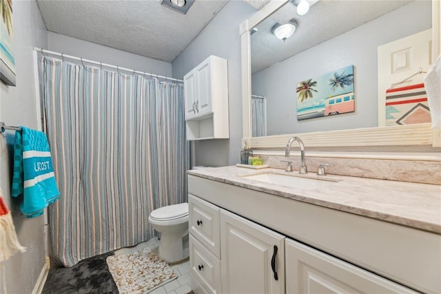 bathroom featuring vanity, toilet, a shower with curtain, and a textured ceiling