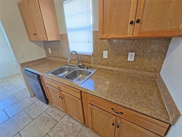 kitchen with dishwasher, light tile patterned floors, backsplash, and a sink