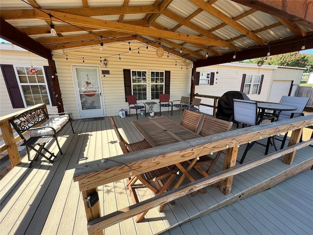 wooden deck featuring outdoor dining space