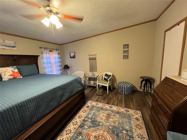 bedroom with ceiling fan, ornamental molding, dark wood-style floors, and a textured ceiling