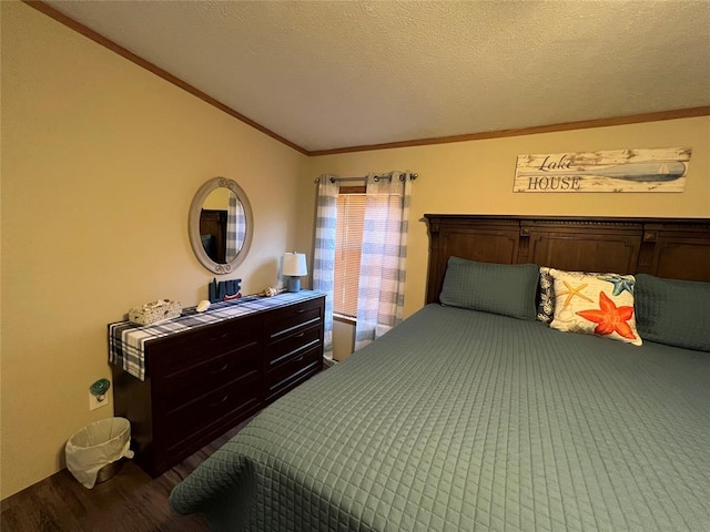 bedroom featuring wood finished floors, a textured ceiling, crown molding, and vaulted ceiling