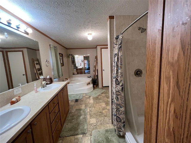 bathroom featuring ornamental molding, stone finish flooring, a stall shower, and a sink