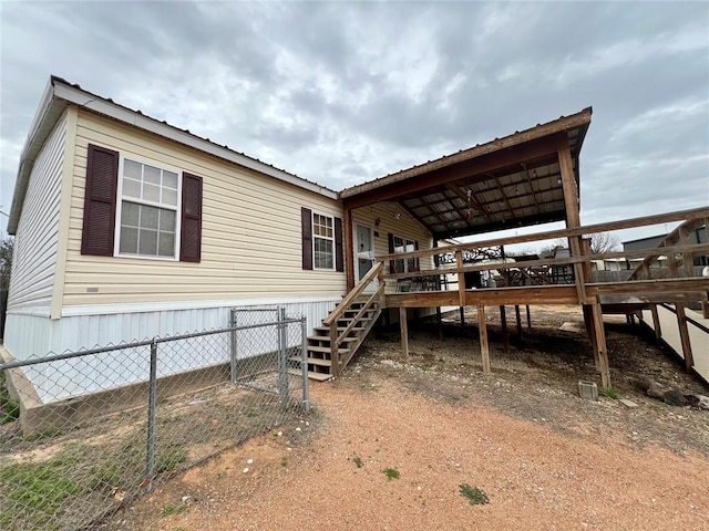 13132 Bluebird Ln, Kingston, OK 73439 - back of house with stairway, a wooden deck, and fence