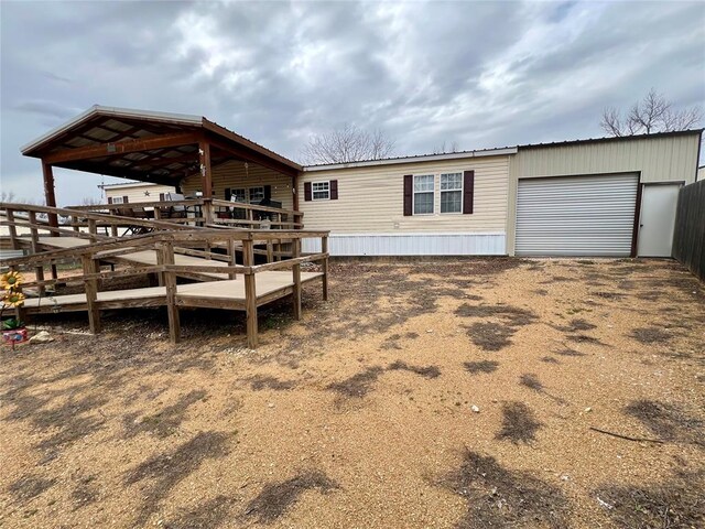 13132 Bluebird Ln, Kingston, OK 73439 - exterior space featuring dirt driveway and an attached garage