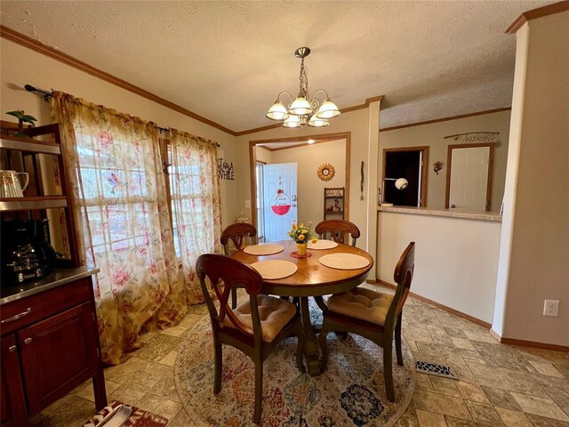 13132 Bluebird Ln, Kingston, OK 73439 - dining room featuring baseboards, a textured ceiling, a chandelier, and ornamental molding