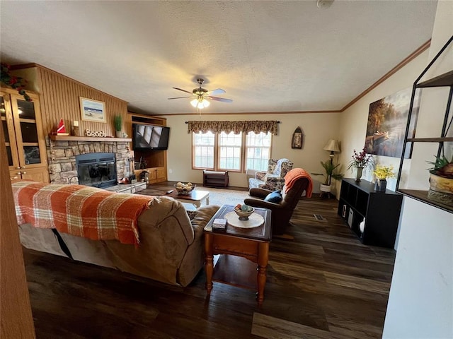 13132 Bluebird Ln, Kingston, OK 73439 - living area featuring ornamental molding, a ceiling fan, a textured ceiling, wood finished floors, and a fireplace