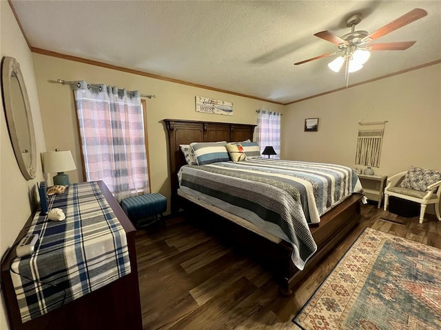 13132 Bluebird Ln, Kingston, OK 73439 - bedroom featuring a ceiling fan, dark wood-type flooring, crown molding, and a textured ceiling