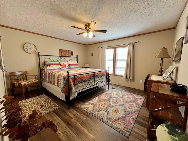 13132 Bluebird Ln, Kingston, OK 73439 - bedroom featuring a ceiling fan, wood finished floors, baseboards, ornamental molding, and a textured ceiling