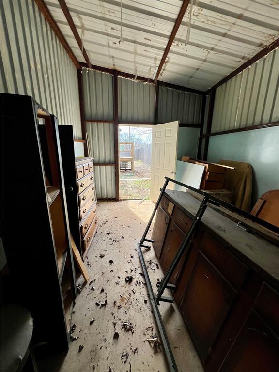 13132 Bluebird Ln, Kingston, OK 73439 - garage featuring metal wall