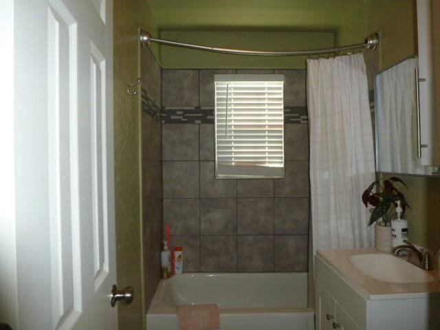 full bathroom with vanity and shower / tub combo with curtain