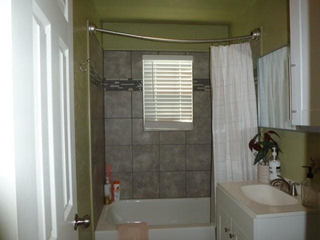 full bath with vanity and shower / tub combo with curtain