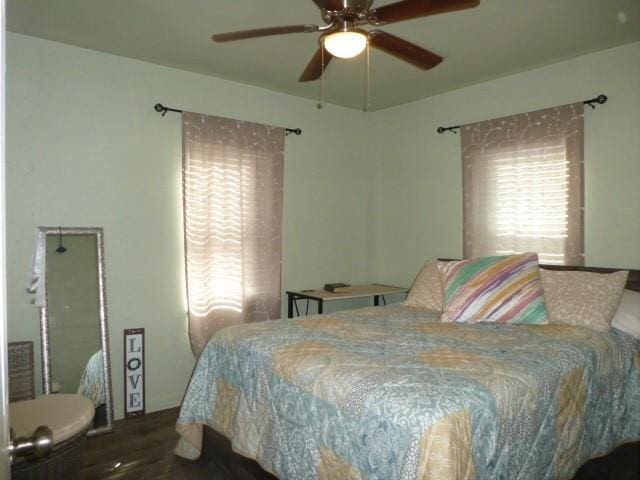 bedroom featuring ceiling fan and wood finished floors