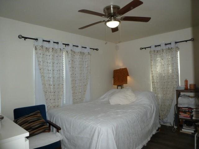 bedroom featuring ceiling fan and wood finished floors