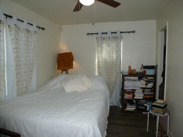 bedroom with ceiling fan and wood finished floors