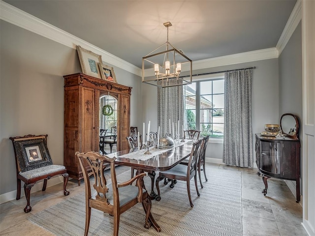 dining room with ornamental molding, baseboards, and a chandelier