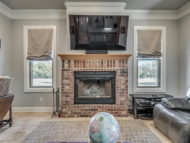 living room with crown molding, a brick fireplace, light tile patterned floors, and baseboards