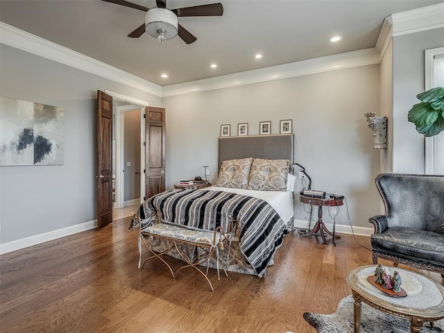 bedroom with baseboards, ornamental molding, recessed lighting, wood finished floors, and a ceiling fan