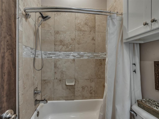 bathroom featuring toilet and shower / bath combo with shower curtain