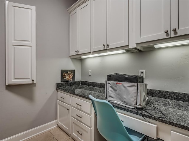 office featuring light tile patterned floors and baseboards