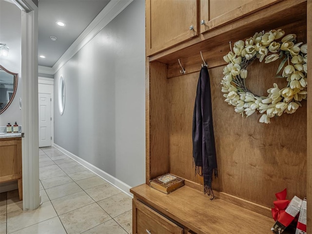 mudroom featuring light tile patterned floors, recessed lighting, baseboards, and ornamental molding