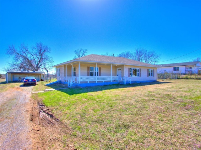 view of front of property with driveway, a porch, and a front lawn