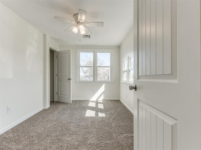 37005 Lake Rd, Shawnee, OK 74801 - carpeted spare room with visible vents, a ceiling fan, and baseboards