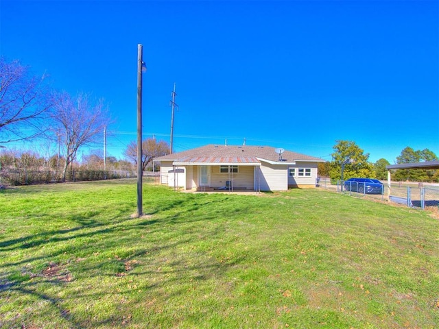 37005 Lake Rd, Shawnee, OK 74801 - back of property featuring a fenced backyard, a patio, and a lawn