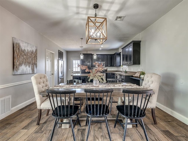 dining room featuring visible vents, baseboards, and dark wood-type flooring