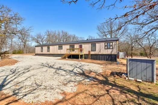 view of front of home featuring a wooden deck