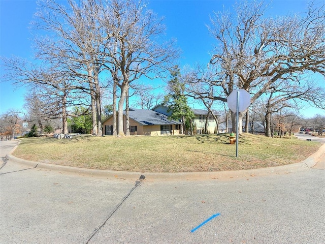 view of front of home with a front lawn