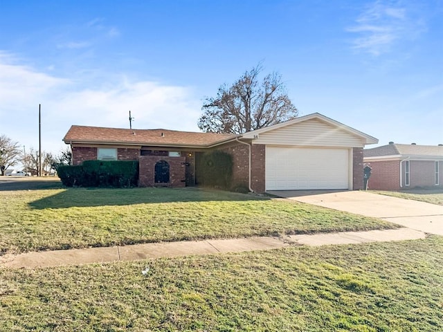 ranch-style home featuring a garage, driveway, a front lawn, and brick siding