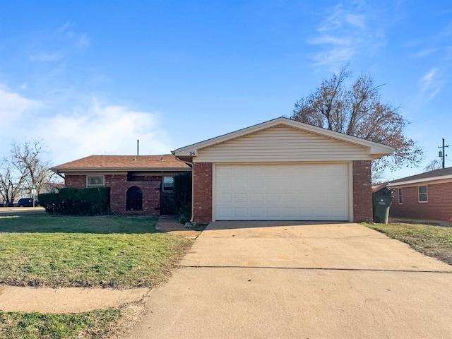 single story home featuring a garage, concrete driveway, brick siding, and a front yard