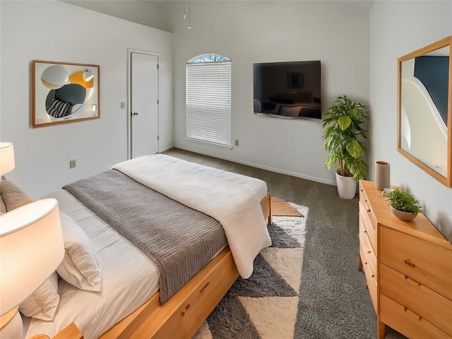 carpeted bedroom featuring baseboards