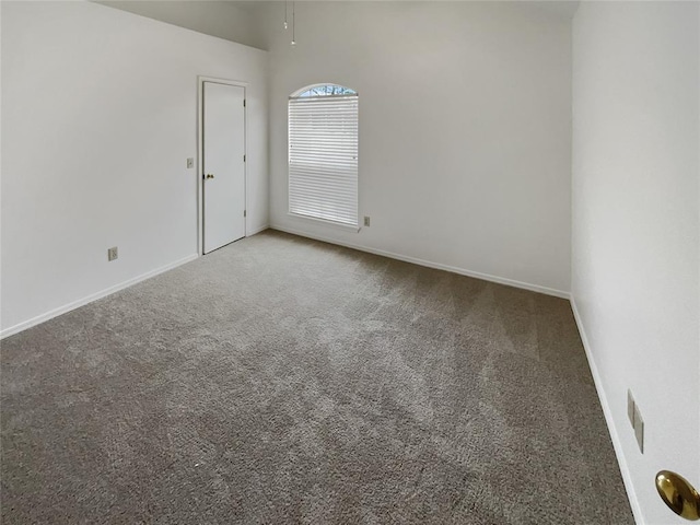 empty room with baseboards and carpet floors