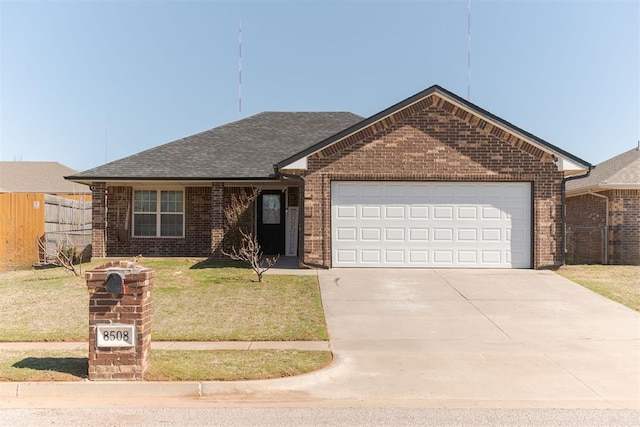 ranch-style house featuring a front yard, fence, driveway, a garage, and brick siding