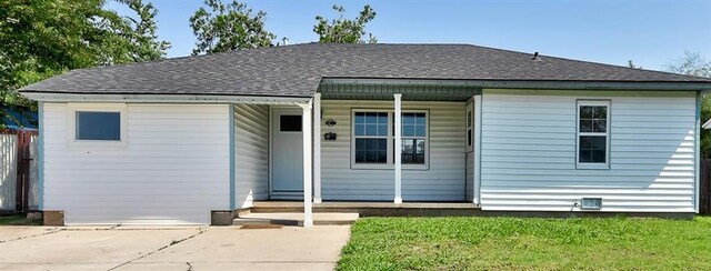 2625 SW 46th St, Oklahoma City, OK 73119 - bungalow-style home featuring roof with shingles and a front lawn