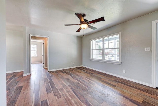2625 SW 46th St, Oklahoma City, OK 73119 - unfurnished room with ceiling fan, dark wood finished floors, and baseboards