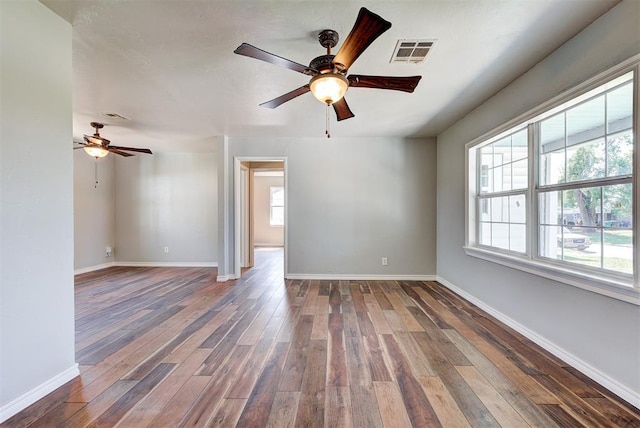 2625 SW 46th St, Oklahoma City, OK 73119 - spare room with a ceiling fan, plenty of natural light, and hardwood / wood-style flooring