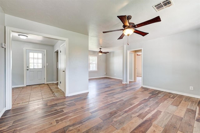 2625 SW 46th St, Oklahoma City, OK 73119 - entryway featuring wood finished floors, a ceiling fan, and baseboards