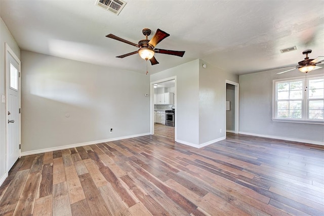 2625 SW 46th St, Oklahoma City, OK 73119 - spare room featuring ceiling fan, hardwood / wood-style floors, and baseboards