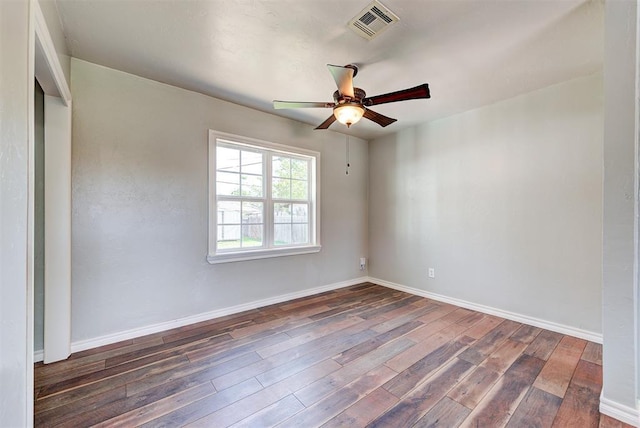 2625 SW 46th St, Oklahoma City, OK 73119 - unfurnished room featuring dark wood-style flooring, a ceiling fan, and baseboards