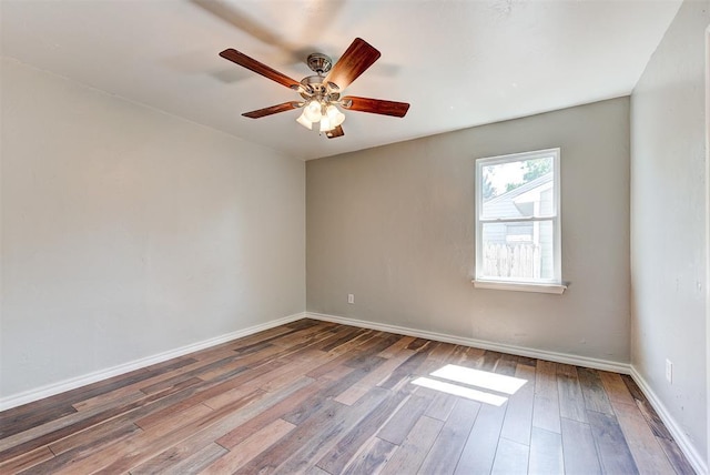 2625 SW 46th St, Oklahoma City, OK 73119 - spare room with wood finished floors, a ceiling fan, and baseboards