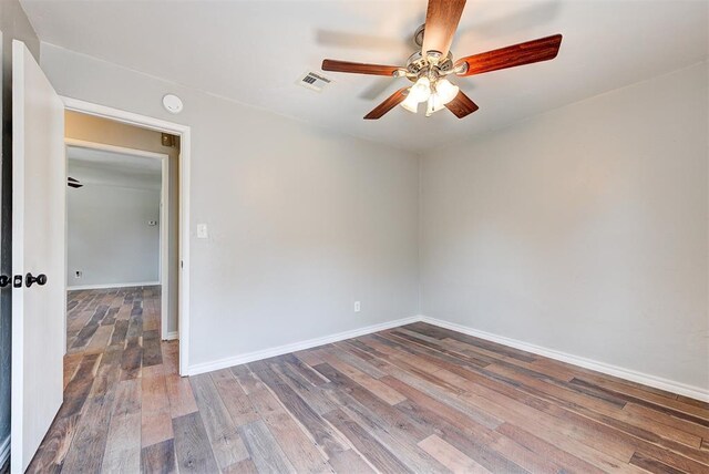 2625 SW 46th St, Oklahoma City, OK 73119 - spare room featuring ceiling fan, wood finished floors, baseboards, and a smoke detector