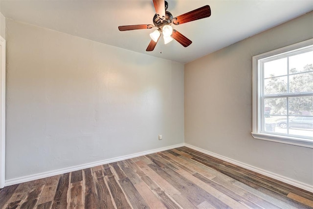 2625 SW 46th St, Oklahoma City, OK 73119 - empty room featuring healthy amount of natural light, wood finished floors, and baseboards