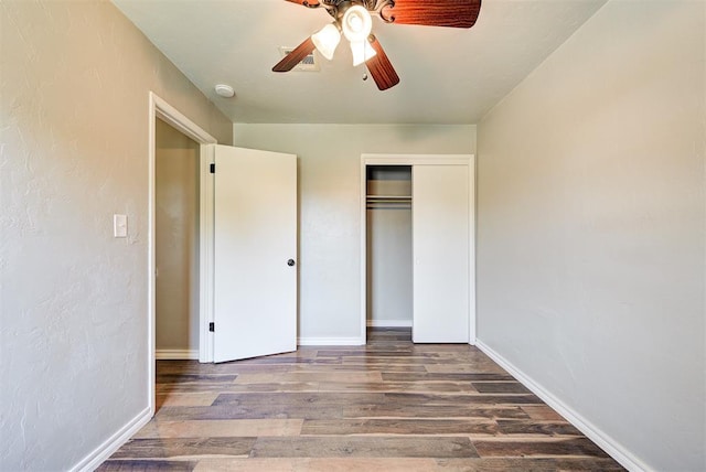 2625 SW 46th St, Oklahoma City, OK 73119 - unfurnished bedroom featuring wood finished floors, baseboards, a closet, and a ceiling fan