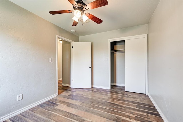 2625 SW 46th St, Oklahoma City, OK 73119 - unfurnished bedroom with wood finished floors, a closet, baseboards, and a ceiling fan
