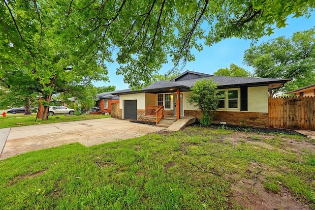 1731 Carlisle Rd, The Village, OK 73120 - view of front facade with an attached garage, driveway, brick siding, covered porch, and stone siding