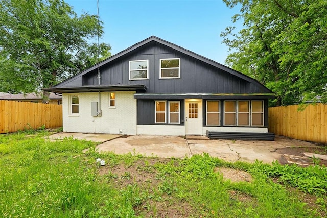 1731 Carlisle Rd, The Village, OK 73120 - rear view of house featuring a patio, a fenced backyard, and brick siding